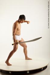 Underwear Fighting with knife Man Asian Average Medium Black Academic
